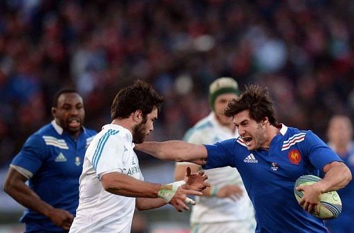 France's scrum-half Maxime Machenaud (R) vies with Italy's winger Luke McLean on February 3, 2013